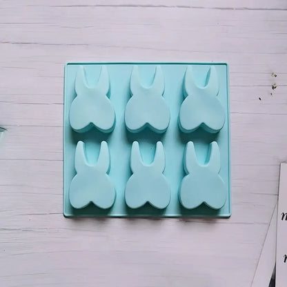 Light blue silicone mold with six bunny-shaped hole tooth silicone cavities for cake biscuit candy ice cube use
