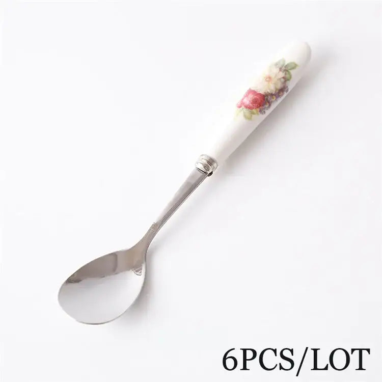 A delicate white ceramic coffee spoon with floral handle and stainless steel bowl from decorbites™ coffee spoon set