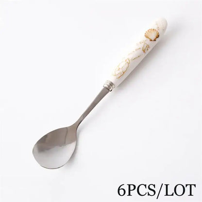 DecorBites™ coffee spoon set with white ceramic handle gold seashell design and stainless steel spoon bowl