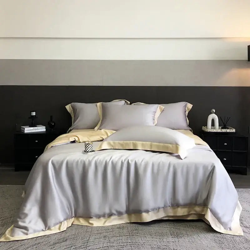 Luxury gray satin duvet cover set with cream piping and matching pillowcases in decorbites™ 600tc lyocell eucalyptus fiber bedding set