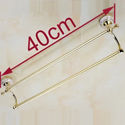 Brass double towel bar with decorative ceramic gold finish end caps for bathroom accessories by decorbites
