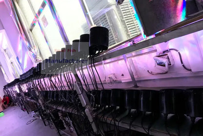 Black cylindrical aquarium air pumps on white tray with purple lighting paired with 60w bee eyes beam par lights