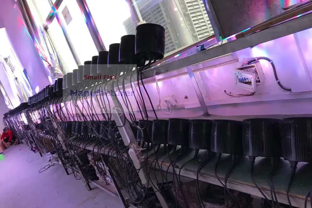 Black cylindrical 60w bee eyes beam rgbw led par lights with ribbed surfaces on metal shelves for stage dj disco use