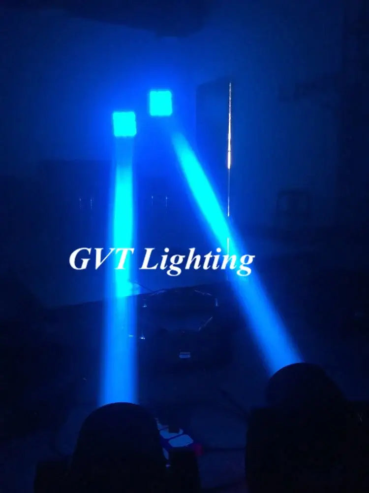 Blue spotlight beams from DecorBites 60w super beam led moving head light cast sharp rectangular patterns on a dark room ceiling