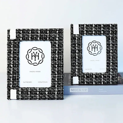 Black and white tweed-textured 6x7 inch fabric framed photo frame with subtle monogrammed emblem for TV cabinet decor