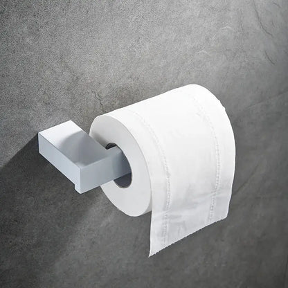 White toilet paper roll on a matte gray wall-mounted holder from the decorbites bathroom hardware set in white
