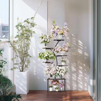 Modern black metal 7 tier plant stand display rack with white, lavender, and pink floral arrangements in various pots