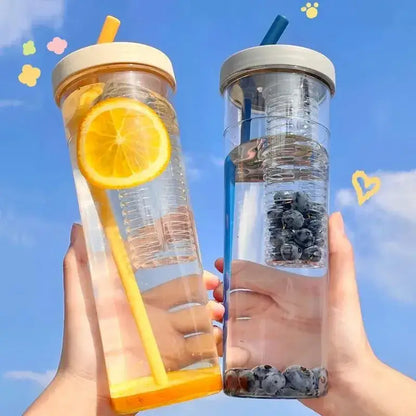 Two transparent decorbites 700ml filtered water bottles with straw lids containing lemon and blueberries ideal for outdoors