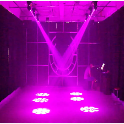 Purplish laser beams from the decorbites 75w led moving head illuminate floral gobos in a dark room setting