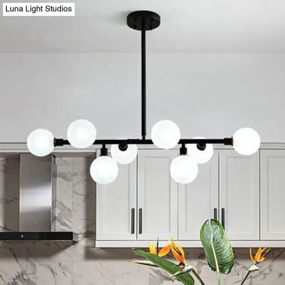 Modern black metal chandelier with frosted glass globe lights e26 e27 for restaurants by DecorBites™