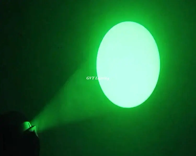 A bright green circular spotlight beam from the decorbites 90w led moving head light for stage events