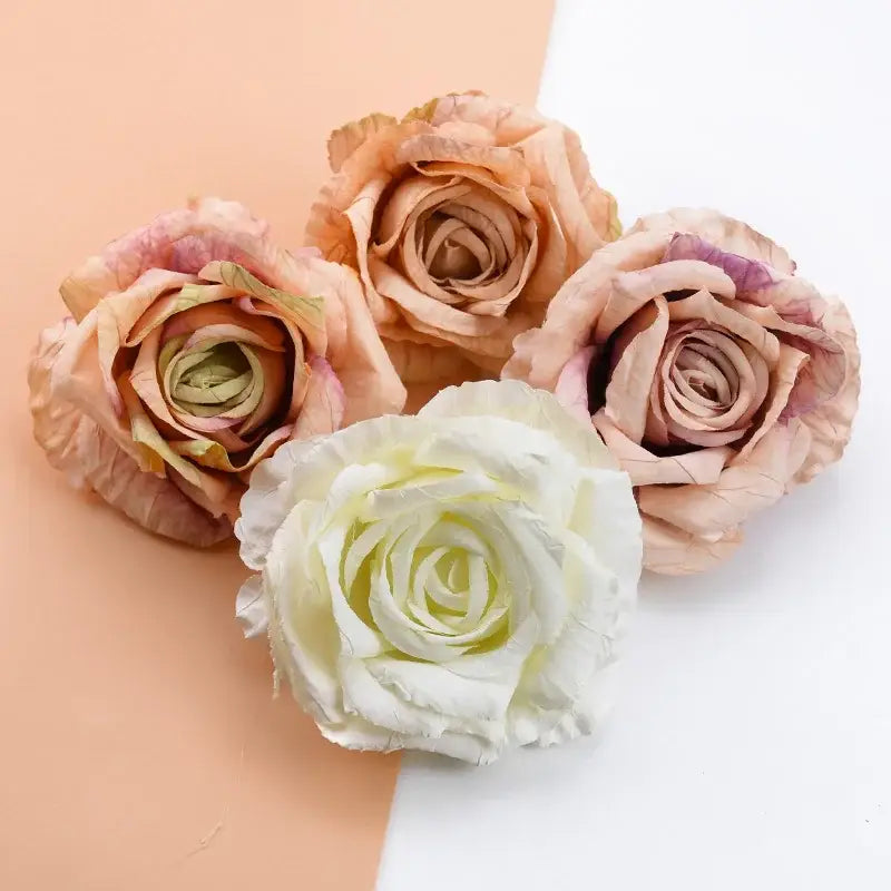 A cluster of DecorBites 9cm silk roses artificial flowers in peach blush and creamy white fabric petals for decor