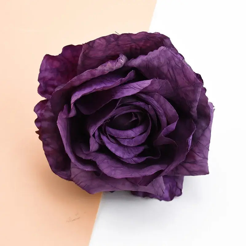 A deep purple 9cm silk rose with crinkled layered petals from decorbites™ artificial flowers for decor and gifts