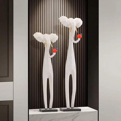 White geometric elephant sculptures with gold tusks on black bases for decorbites abstract art living room decor