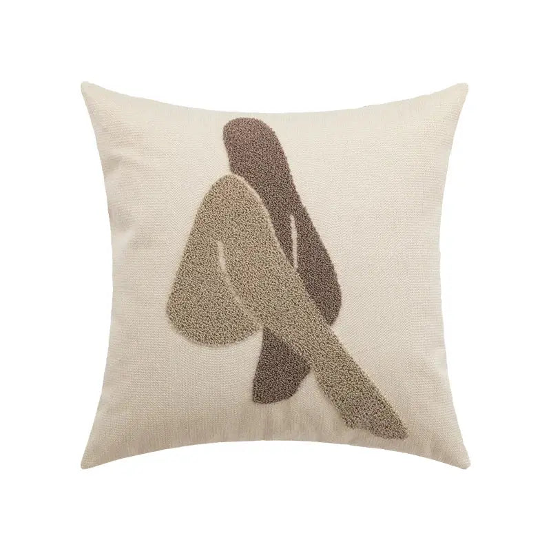 Beige cushion cover with abstract embroidered figure in coffee brown and tan tones by decorbites abstract beige