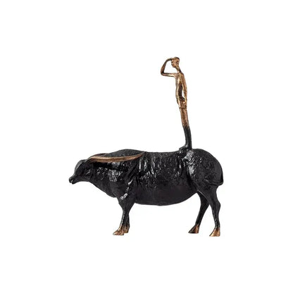 Decorbites abstract black yak golden metal figurine featuring a black and bronze man standing atop a bull sculpture