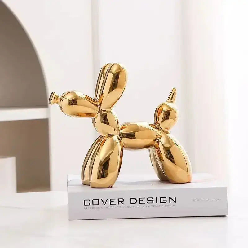 Golden glossy ballot dog figurine with sleek reflective surfaces in decorbites abstract ceramic balloon sculpture design