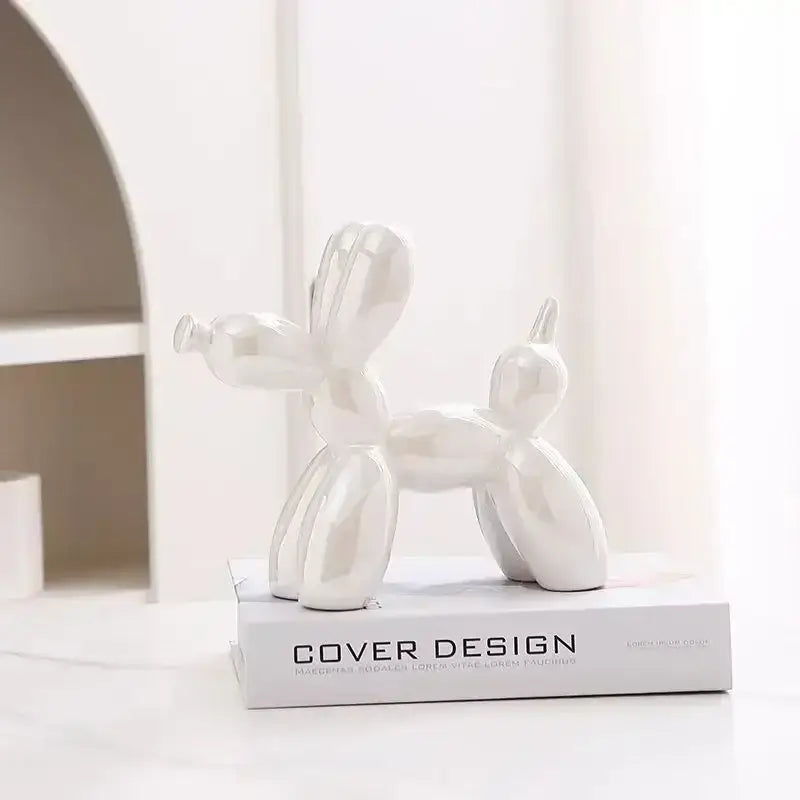 A glossy white ceramic balloon dog figurine with sleek minimalist design from decorbites abstract ceramic collection