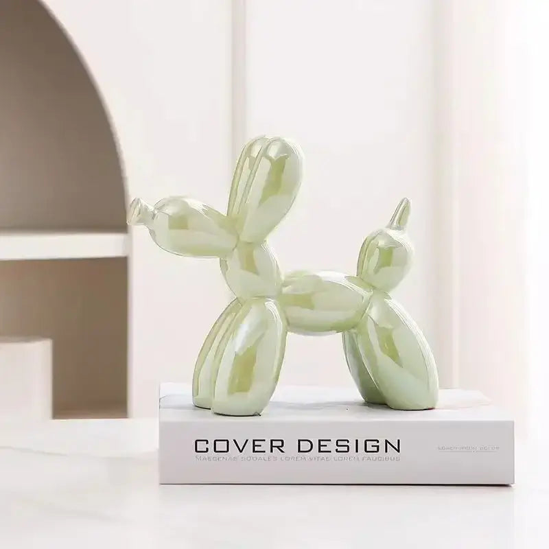 A glossy mint-green decorbites abstract ceramic balloon dog sculpture for modern home and office decor