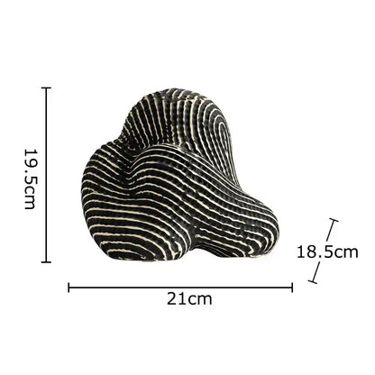 A sleek black and white striped decorbites abstract ceramic rockery sculpture ornament for desk decoration