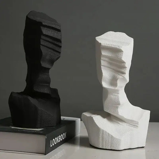 Black and white abstract characters sculpture bookends with textured layered surfaces for modern living room decor by decorbites