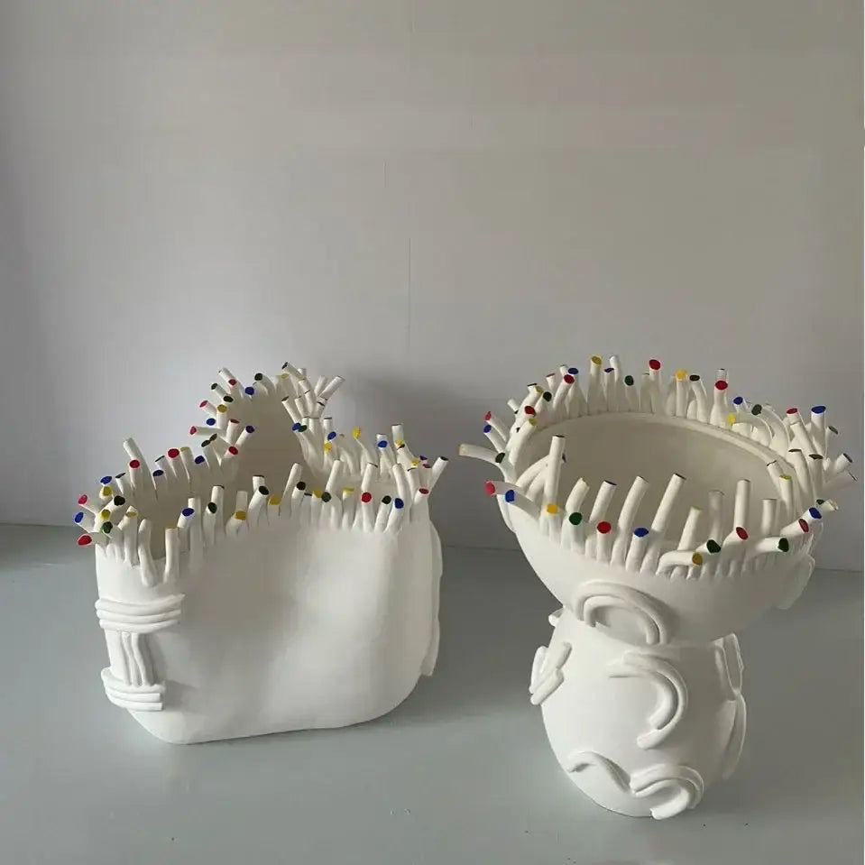 White ceramic decorbites abstract coral vases with sculpted faces and colorful pin-like coral shapes flower decorations