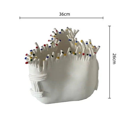 White ceramic decorbites abstract coral matchstick holder with colorful tipped matches and textured coral shapes flower surface