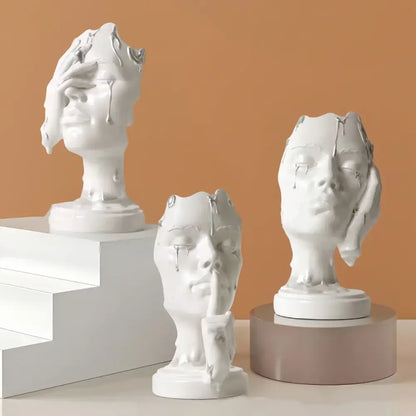 Three white ceramic busts with abstract melting faces and silver accents decorbites abstract face mask home decor statues