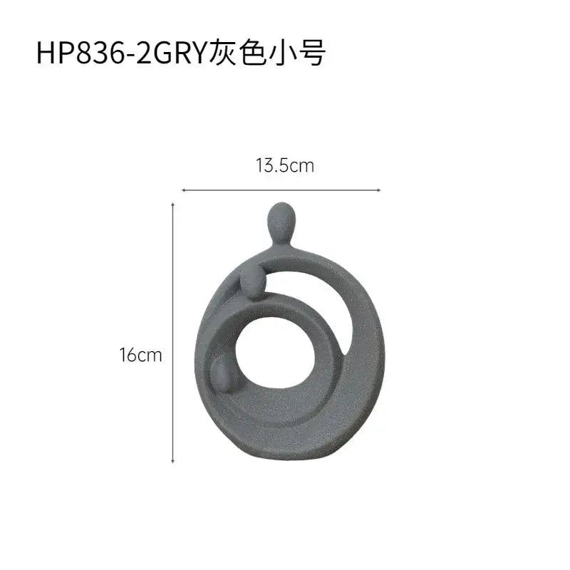 Gray ceramic decorbites abstract family sculpture set featuring an abstract family sculpture with circular and rounded elements