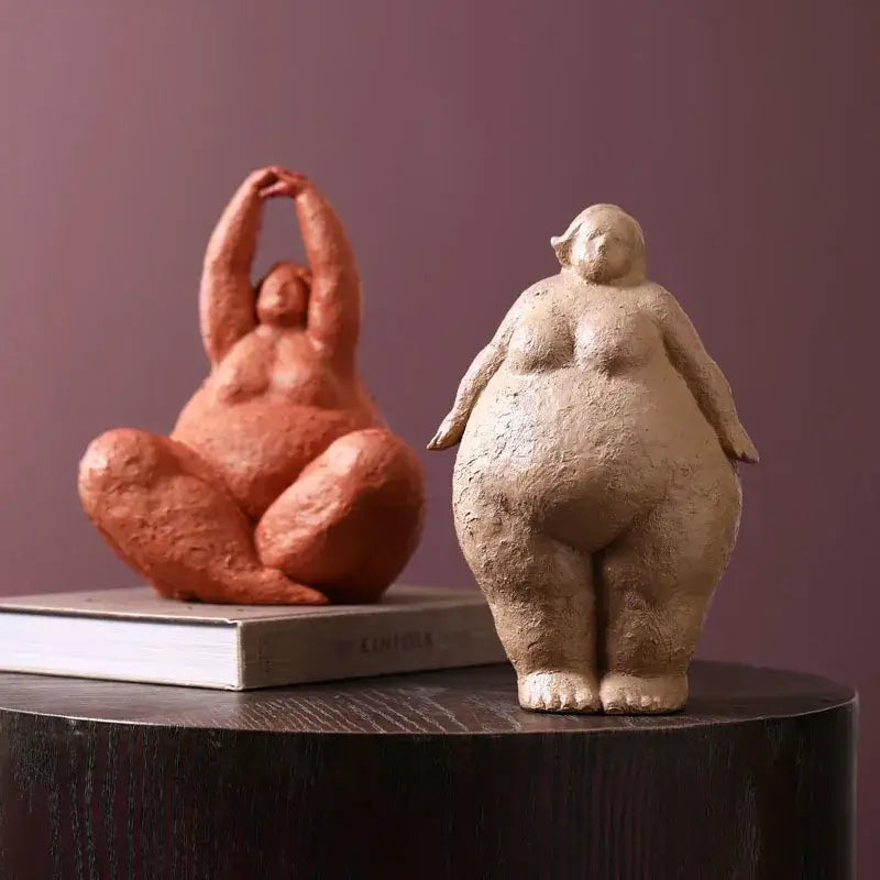 Two decorbites abstract fat lady figurines in reddish-brown and beige resin showcasing vintage curvy women statues