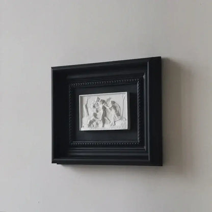 Black framed white decorbites abstract figure relief sculpture decorative painting showing figures in motion