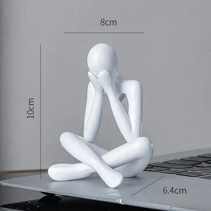 White glossy resin decorbites abstract figures ornament sculpture of a seated contemplative figure for home office decor