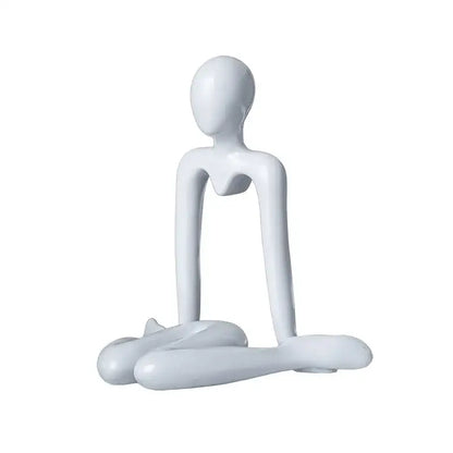 White glossy resin decorbites abstract figures ornament sculpture of a minimalist seated human form for home decor