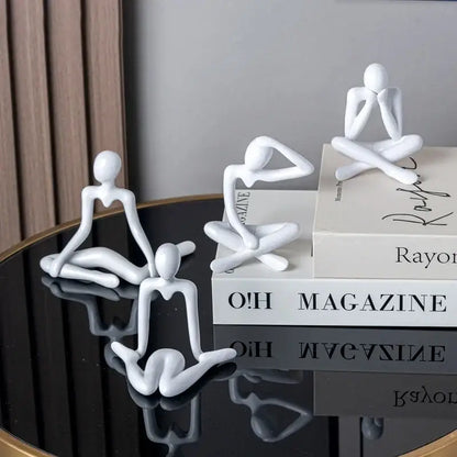 White minimalist decorbites abstract figures ornament sculpture with smooth glossy surfaces in various seated poses for home decor