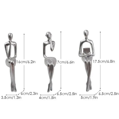 Set of three silver-toned decorbites abstract figurines with minimalist design for modern home and office decor