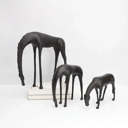 Set of three sleek black resin horse iron sculptures with elongated legs and stylized manes decorbites abstract horse decor