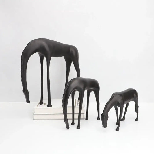 Set of three sleek black resin horse iron sculptures with elongated legs and stylized manes by Decorbites abstract horse