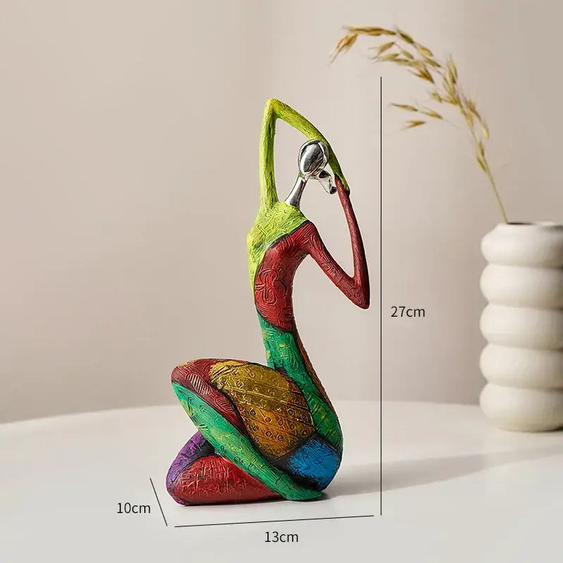 Vibrant multi-colored resin decorbites abstract woman sculpture with intricate patterns and metallic silver headpiece for living room decor