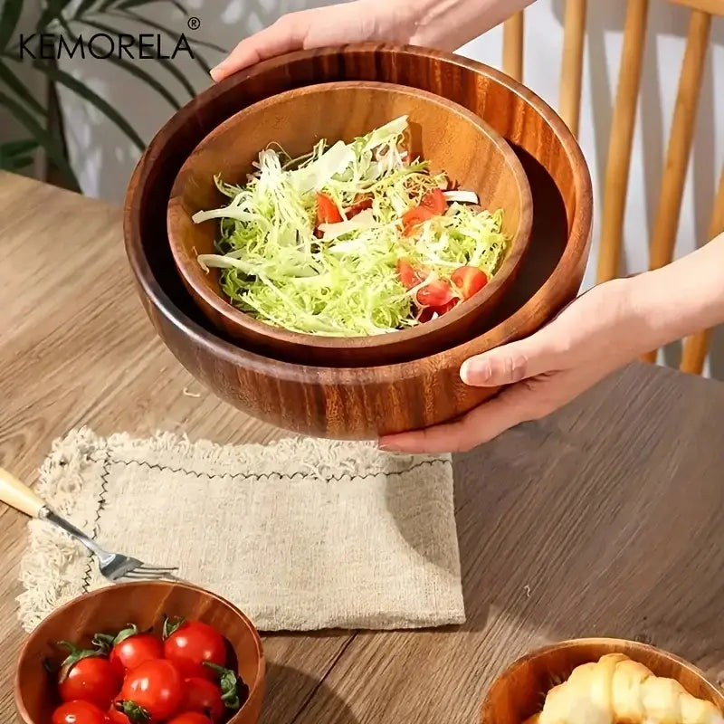 Set of two nested acacia wooden salad bowls with warm brown finish and visible wood grain for fruit and vegetables