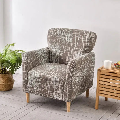 Gray fabric accent chair with white abstract grid pattern and light wooden legs featuring DecorBites accent chair cover slipcover