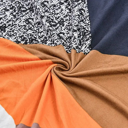 DecorBites accent chair cover slipcovers with swirled orange brown navy blue and black and white abstract fabric design