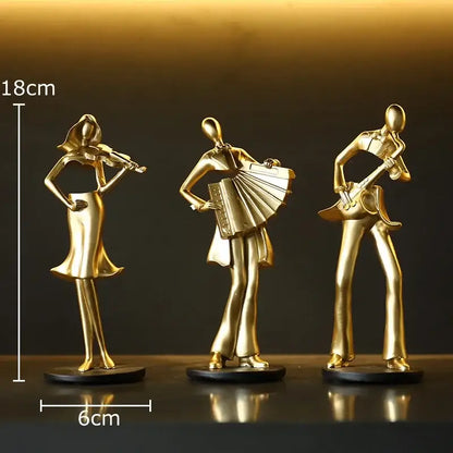 Set of three golden metallic musician resin sculptures featuring accordion musician violinist and guitarist for decor
