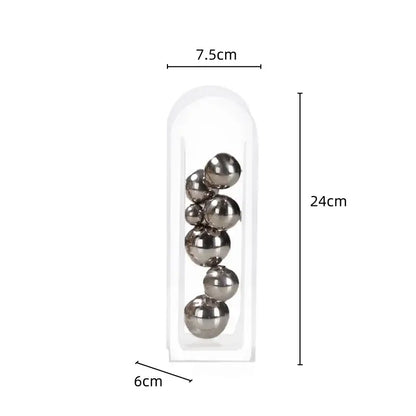 A clear acrylic ball vase stack featuring seven polished metallic spheres in a decorbites acrylic ball vase accessory