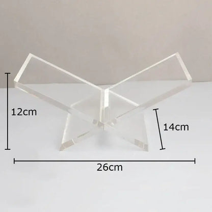 Clear acrylic butterfly-shaped bookshelf with marble base for modern home decor and organized storage