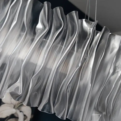 A sleek silver translucent pleated curtain with glossy wave folds for decorbites acrylic ceiling chandelier installation