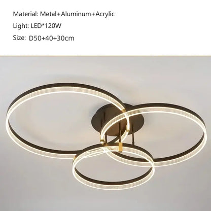 DecorBites™ acrylic ceiling chandelier with three interlocking black rings featuring glowing LED illumination