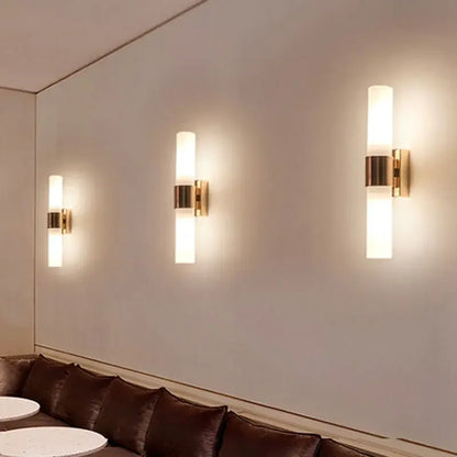 Modern gold-toned decorbites acrylic cylinder wall lamp with frosted glass shades for bedroom and living room lighting