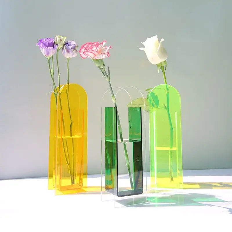 DecorBites acrylic flower vase set with three translucent yellow, green, and lime green acrylic flower containers
