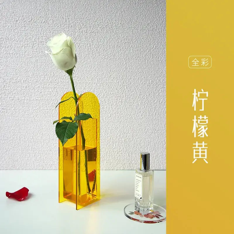 Decorbites acrylic flower vase in translucent yellow with modern geometric design holding a white rose for home office decor