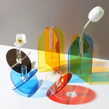 Decorbites™ acrylic flower vase in vibrant rainbow hues with sleek curved design and glass tubes holding white tulips